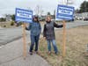 Sophia Viglas and friend holding signs at the polls
