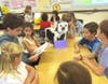 A Thomas Blake Middle School seventh grader, left, displayed a creature and read an original story about it to elementary school students as part of the 15th annual Creature Feature event.