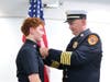 FF/EMT Caroline Conlin being pinned by Chief DeKing