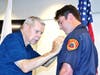 FF/EMT Liam Frazier being pinned by his uncle.