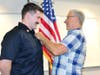 FF/Paramedic Nick Novitch being pinned by his dad.