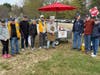Medfield Lions posing with the Hot Dog Wagon during the Golf Ball Drop at the Wheelock grounds