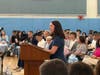 Guidance Counselor Anne Lodge, announcing the Hall of Excellence Recipient