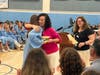 Science teacher Orla Berry getting a hug after announcing departmental awards