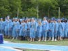 Graduates standing during the National Anthem