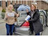 Dr. Julia Ingersoll of Harcum College hands off a carload of Personal Protection Equipment to Carol Prushan of the Einstein Healthcare Network.