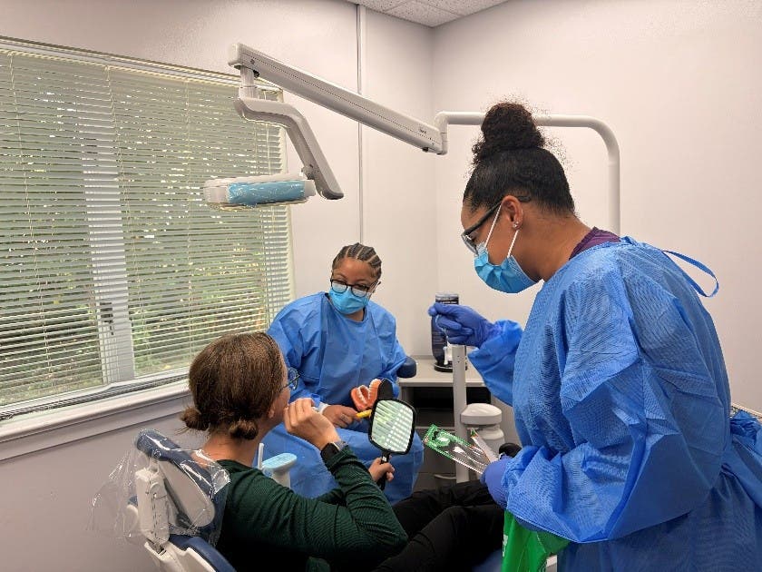 Photo: (l-r) A patient is cared for by Harcum College Dental Hygiene students Nylah Brown ‘27 and Amante Johnson ‘27.