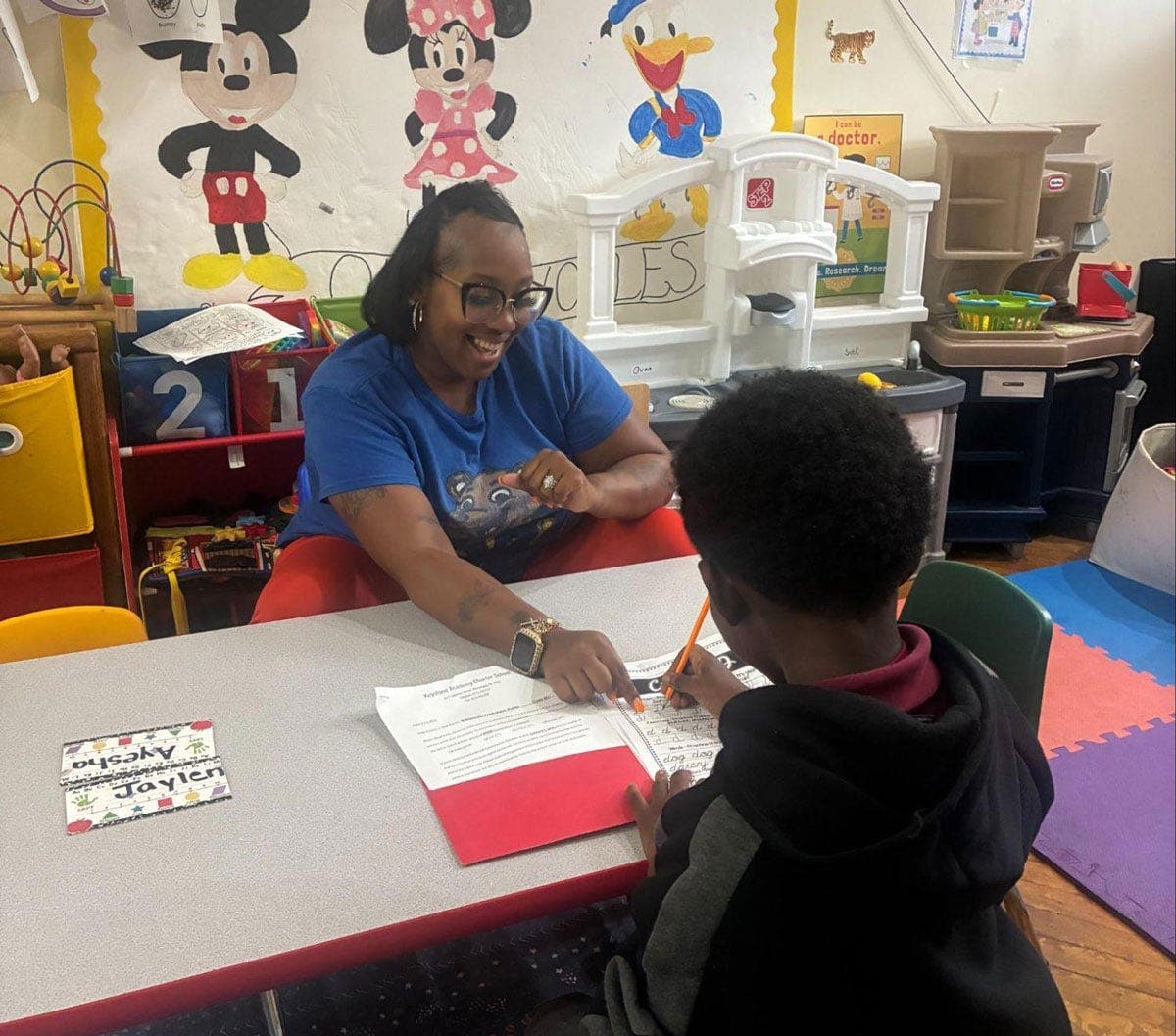 Andrea Brown ’27 works with children at Kidz Pic N' Play Childcare Center.