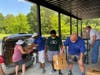 Gwinnett Rotarians volunteer to help with Farmers to Family Food Box Distribution to families in need.
