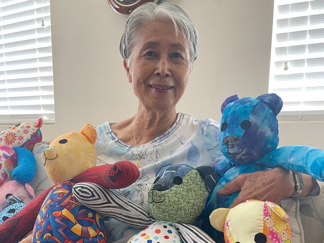 Redwood Terrace resident Michiko Rice and some of the bears she's worked on.