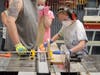 Abigail using the table saw