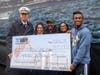 Avinash Ganguly , along with his family and Rear Admiral Brendan McLane, Commander Navy Recruiting Command.