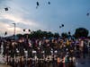New 2021 Renaissance Academy Charter School Graduates tossing their hats in the air