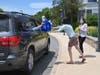 Clair Ward and Director of Advancement Katie Kozin distributed gift bags through car windows.