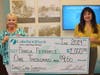 Lakeland Bank Branch Manager Eftychia Gizas (r) presents a $1,000 check to Pamela Petronaci. Petronaci was randomly selected as a winner of the Lakeland Bank 50th Anniversary Debit Mastercard® Sweepstakes.