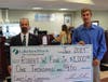 Lakeland Bank Branch Manager Jim Konzel (l) presents a $1,000 check to Robert Fehr, Jr. Fehr was randomly selected as the final winner of the Lakeland Bank 50th Anniversary Debit Mastercard® Sweepstakes.