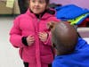Glen Cove Rotary delight Club members with coats and accessories. 