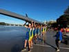 Annapolis Junior Rowers prepare to launch their rowing shell for 3 mile race
