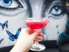 Pluto Matters - Tanqueray Gin, creme de violette, concord grape shrub, chambord, lemon, pop rocks rim