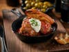 Manzo Meatballs - "Chicago's Best" ground beef, braised beef cheeks, pomodoro, whipped herb ricotta