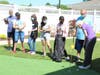 Lifelong golfer and Grace Point Place resident Ruth Lang shares putting tips with her new friends from AERO Special Education Cooperative.