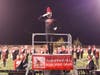 Tyler Wyka salutes the fans with the PHS Marching Band in Mt. Olive