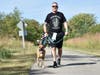 NL VFW Post 9545 Commander Clarke Christiansen making the walk with his sidekick Velma.