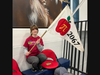 Team Member Jessica Wilson readies the Apple Pi Banner prior to a qualification match in Hartford, CT.
