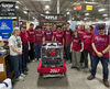Apple Pi Team #2067 is seen surrounding their 2026 Robot “Pi-Ceratops” in their working pit during the 2026 New England District Championship Event.