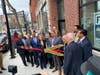 Lawrence Mayor Brian DePeña, GLCAC Executive Director Evelyn Friedman, and GLCAC Board President Johan Lopez ceremonially cut the ribbon along with other guests on April 7 at the newly redeveloped 370 Essex St.