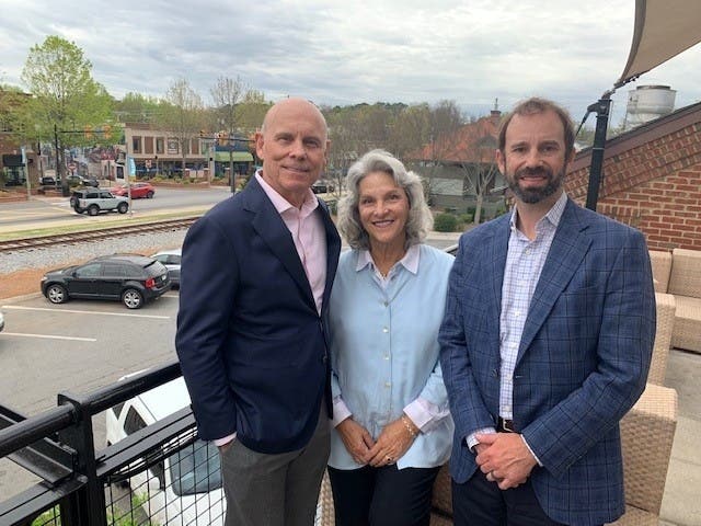 Burroughs & Chapin Purchases Woodstock Downtown from Morris & Fellows.  Pictured in Woodstock (L-R):  James W. Apple, Jr., Burroughs & Chapin president & CEO, Cheri Morris, president, Morris & Fellows, and Chad E. Carlson, CFO, Burroughs & Chapin