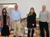Meltzer Lippe employees donated 8,000 pounds of food to Long Island Cares annual food drive. Pictured left to right: Debbie Frascino, Thomas J. McGowan, Melissa Tagarelli, David J. Heymann.