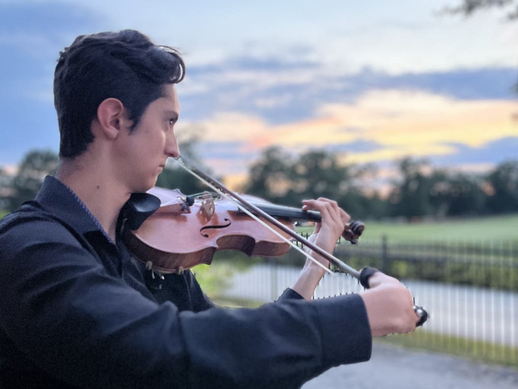 Josiah Mendenhall of Chester, PA, warming up before the Concerto Competition at The Philadelphia International Music Festival, featuring members of The Philadelphia Orchestra