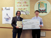 Library Director Ted Gutmann with 1st Place Winner (7 - 9th grade category) Matthew Blumenthal receiving his big check