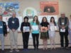 Winners with Library Director and Library Trustees (l to r: Ted Gutmann, Christopher Fletcher, Julia Hou, Amelia Grant, Celia Gordon, Caroline Qian, David Douglas, and Carol Leister).