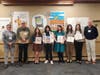 All Winners with Library Trustees and Ted Gutmann (Library Director Ted Gutmann, Library Board Treasurer David Douglas, Elizabeth Wright, Julia Hou, Juni Een, Justine Bushman, Claire Sloniewsky, and Library Board President Christopher Fletcher)