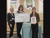 1st Place Winner Elizabeth Wright (Grades 9 - 12 category) receiving her big check from Emma Clark Library Director Theresa Liguori and Karen Shack Reid, daughter of the late Helen Stein Shack.
