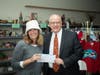 Open Cupboard Executive Director Jennifer Tavormina (left) receives the donation from Unity Bank Relationship Manager Tom Kasper.
