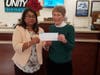 Unity Bank Assistant Relationship Manager Neetu Singh (left) presents donation to Nancy O’Malley, Assistant Treasurer of the Readington Area Starfish.