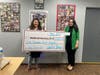 Allie O’Brien, Development Director of the Franklin Food Bank, (left) receives the $1,800 donation from Evrim Cicek, Unity Bank Area Manager.
