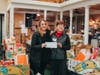 Wendy Ewen, Unity Bank Area Manager, (left) presents the $1,800 donation to Lois Bennett, Feeding Hands Executive Director and Founder.
