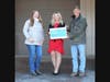 Tracy Tortorello (center), Unity Clinton and Washington Area Manager, presents the donation to Heather Mulvey (left), AGAR Director of Development,  and Chip Paillex, AGAR President and Founder.