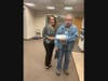 Paola Tascon (left), Unity Bank Operations Manager, presents a $1,600 donation to LINCS Member Jay Dertinger.
