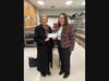 Janice Ballou (left), Chair of the Highland Park Community Food Pantry, receives a $1,600 donation from Cassie Doherty, Unity Bank Area Manager.