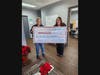 Allie O'Brien (left), Franklin Food Bank Development Director, receives a $1,600 donation from Cassie Doherty, Unity Bank Area Manager.