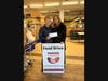 Lois Bennett (left), Executive Director and Founder of Feeding Hands, receives a $1,600 donation from Wendy Ewen, Unity Bank Area Manager.