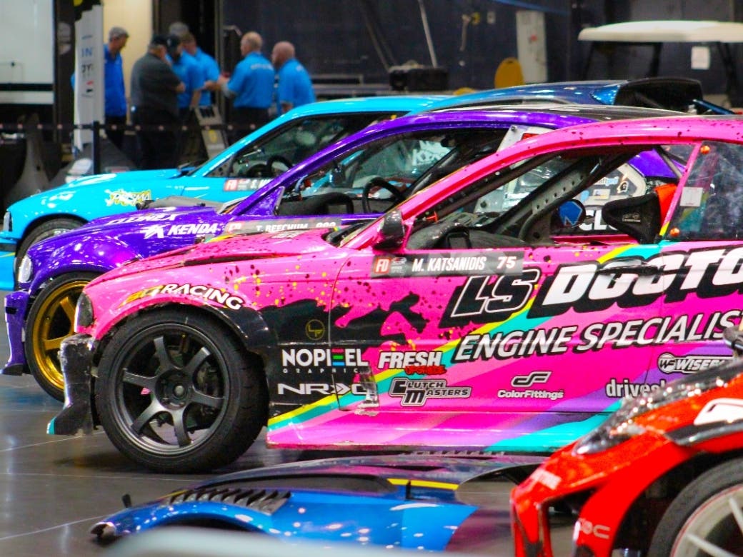 Margartis Katsanidis' pink LS Doctor E46 BMW and other BMWs prepare for the Formula DRIFT Challenge at the 51st Acura Grand Prix of Long Beach.