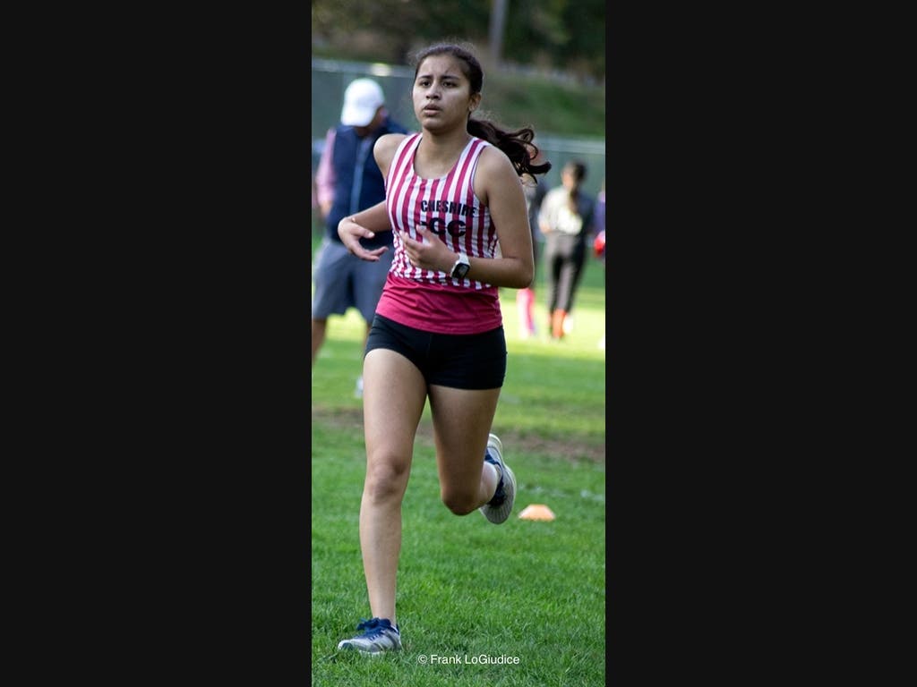 CHS Student Cross Country Athlete Dipti Rajbongshi Heads For The Finish Line At The Cheshire Park Meet Against Wallingford's Lyman Hall High School.  Her Team Won 1st Place.

