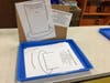 Students designed stove pipe hats to prepare for the author visit.