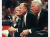 Miami Heat assistant coach Bob Staak (center) talks to players on the court from the bench sitting next to head coach Kevin Loughery (right) during a game against the Indiana Pacers at Market Square Arena in Indianapolis April 16, 1994.